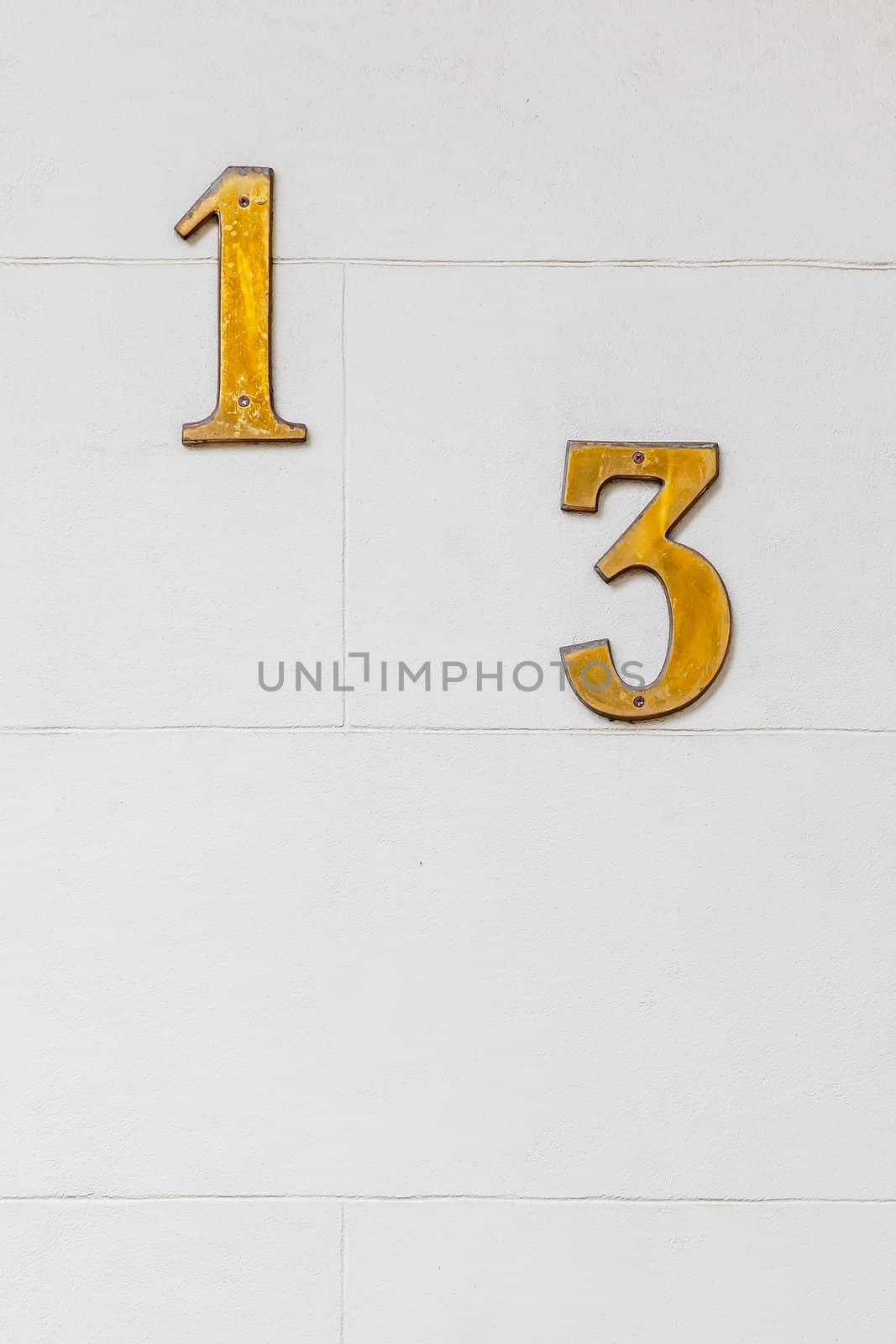 An image of the number 13 on the wall