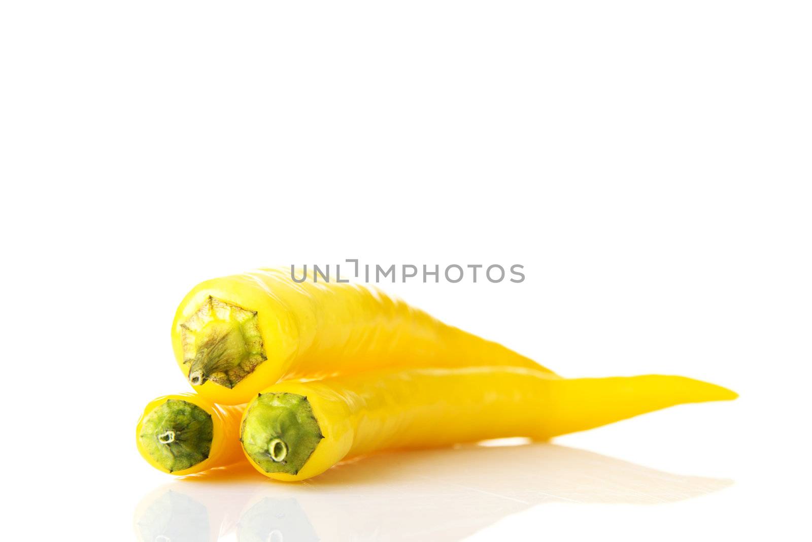Yellow hot chilie peppers, isolated on white