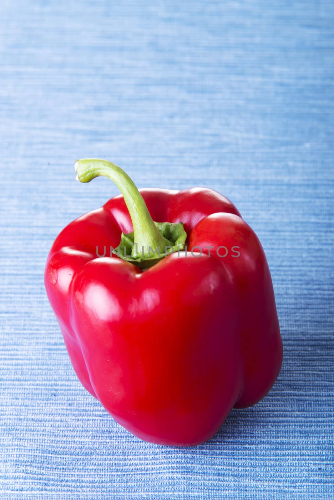 Red sweet pepper on table