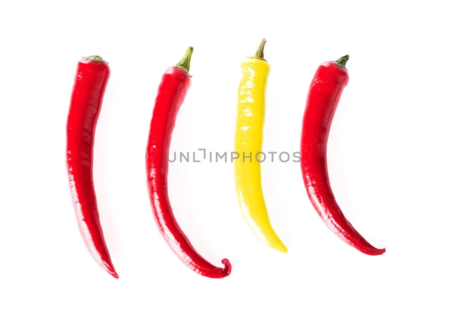 Red and yellow hot chilie peppers, isolated on white