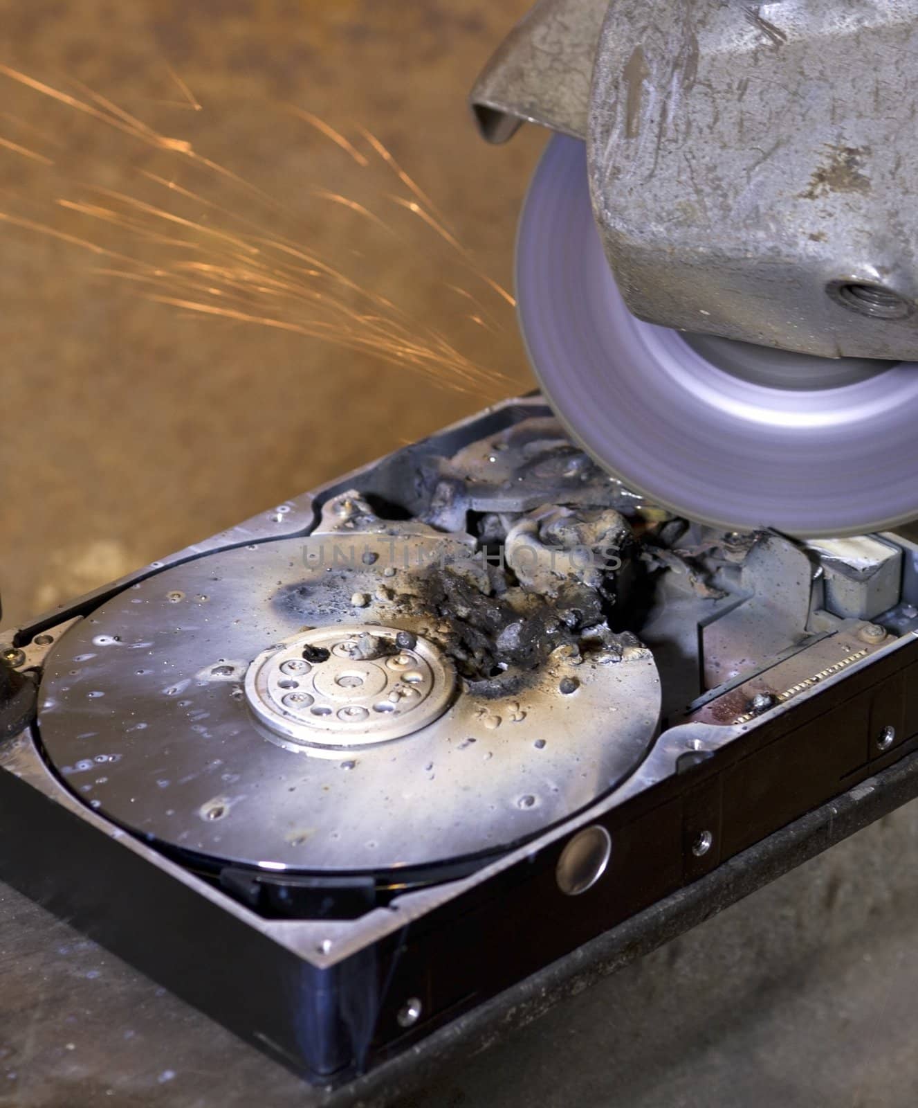 destroyed hard drive with angle grinder