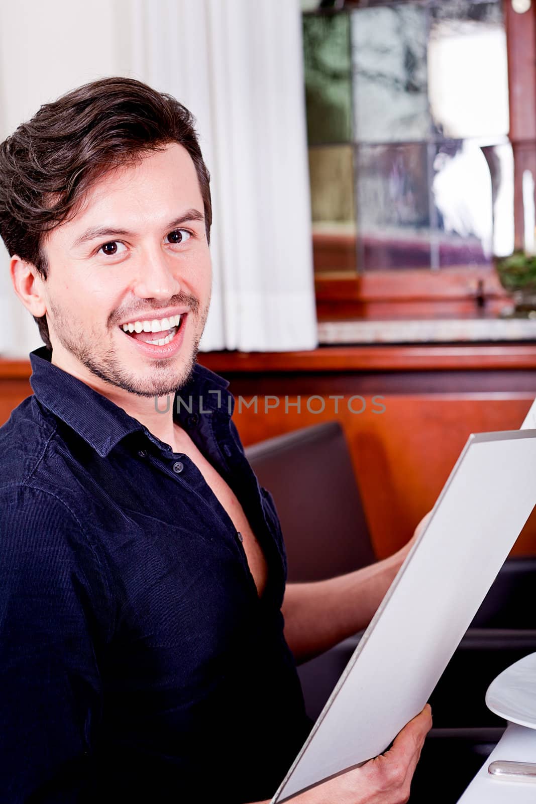 man and woman in restaurant waiter bring card and order food