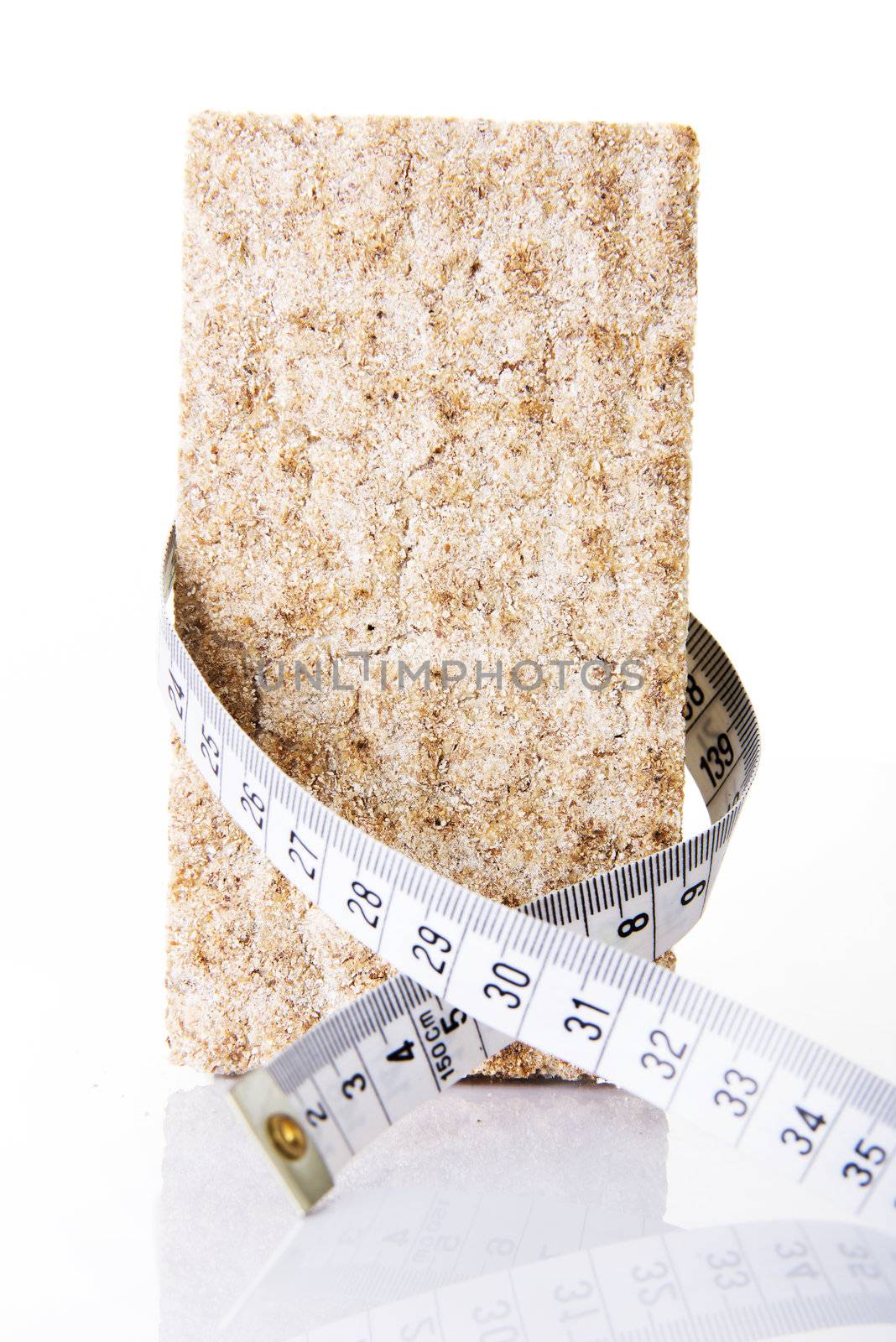 Healthy rye cracker bread with measuring tapy for diet concept