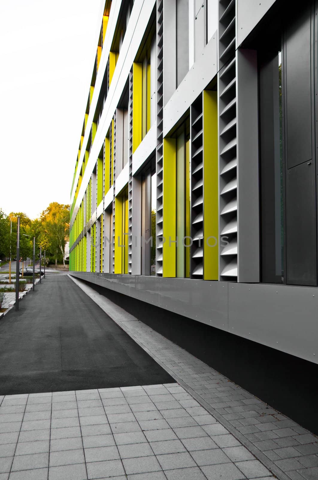 cladding on business building in grey, yellow and green