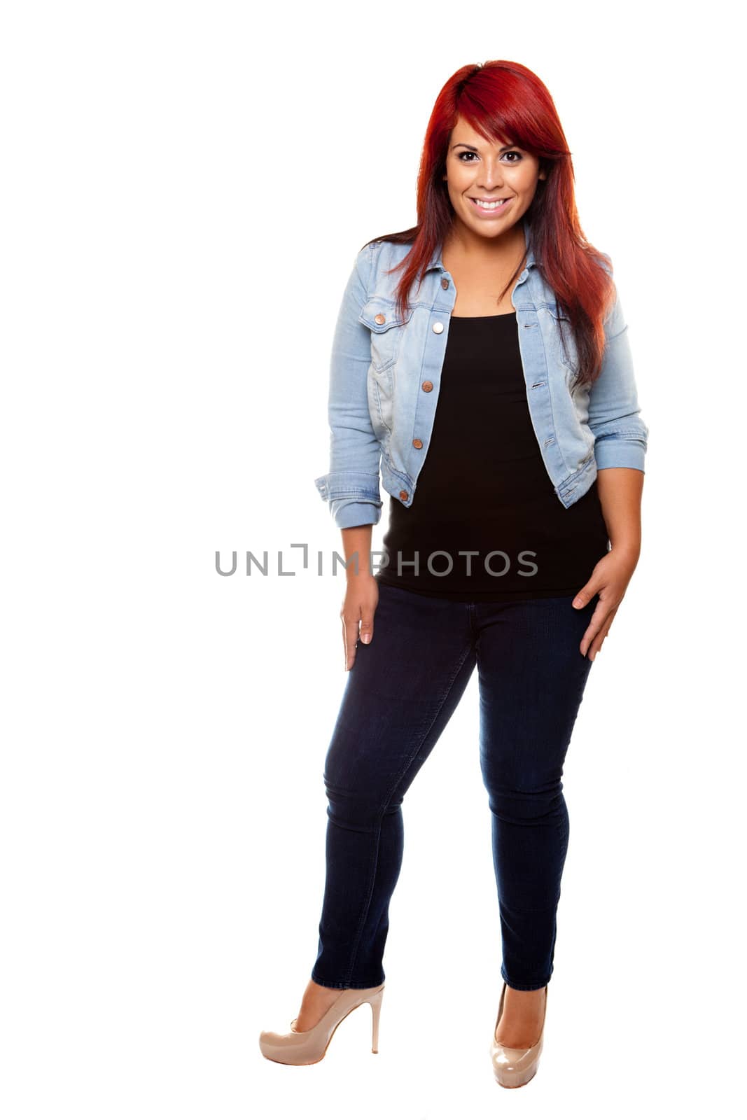 Young woman proudly shows off her physique wearing jeans over a white background.