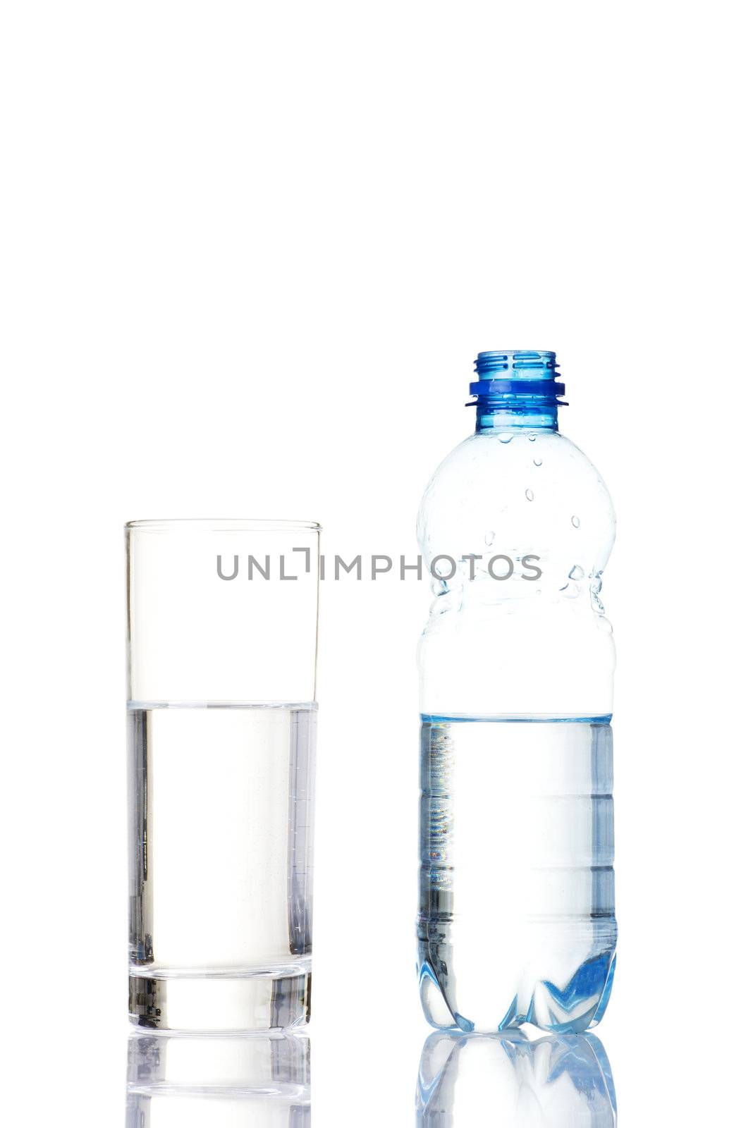 Bottle of water and glass. by BDS