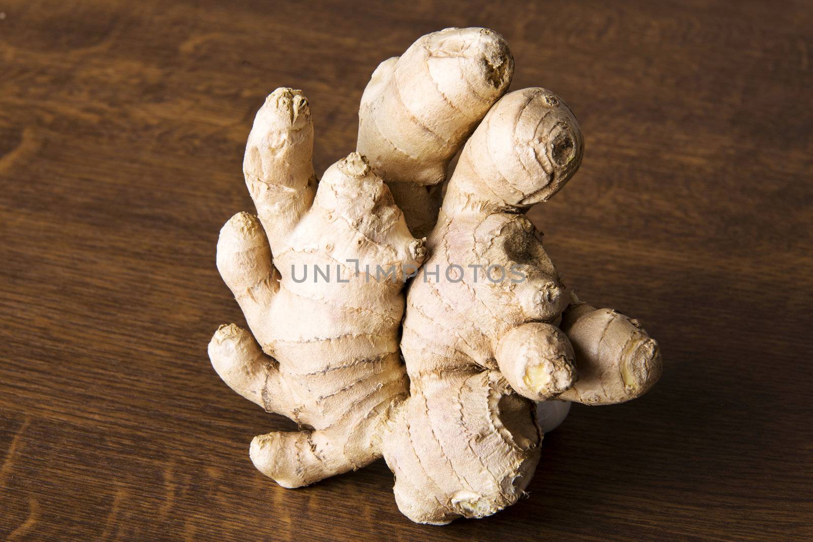 Ginger on kitchen wooden table.