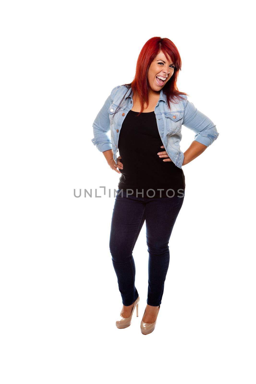 Young woman proudly shows off her physique with her hands on her hips wearing jeans over a white background.