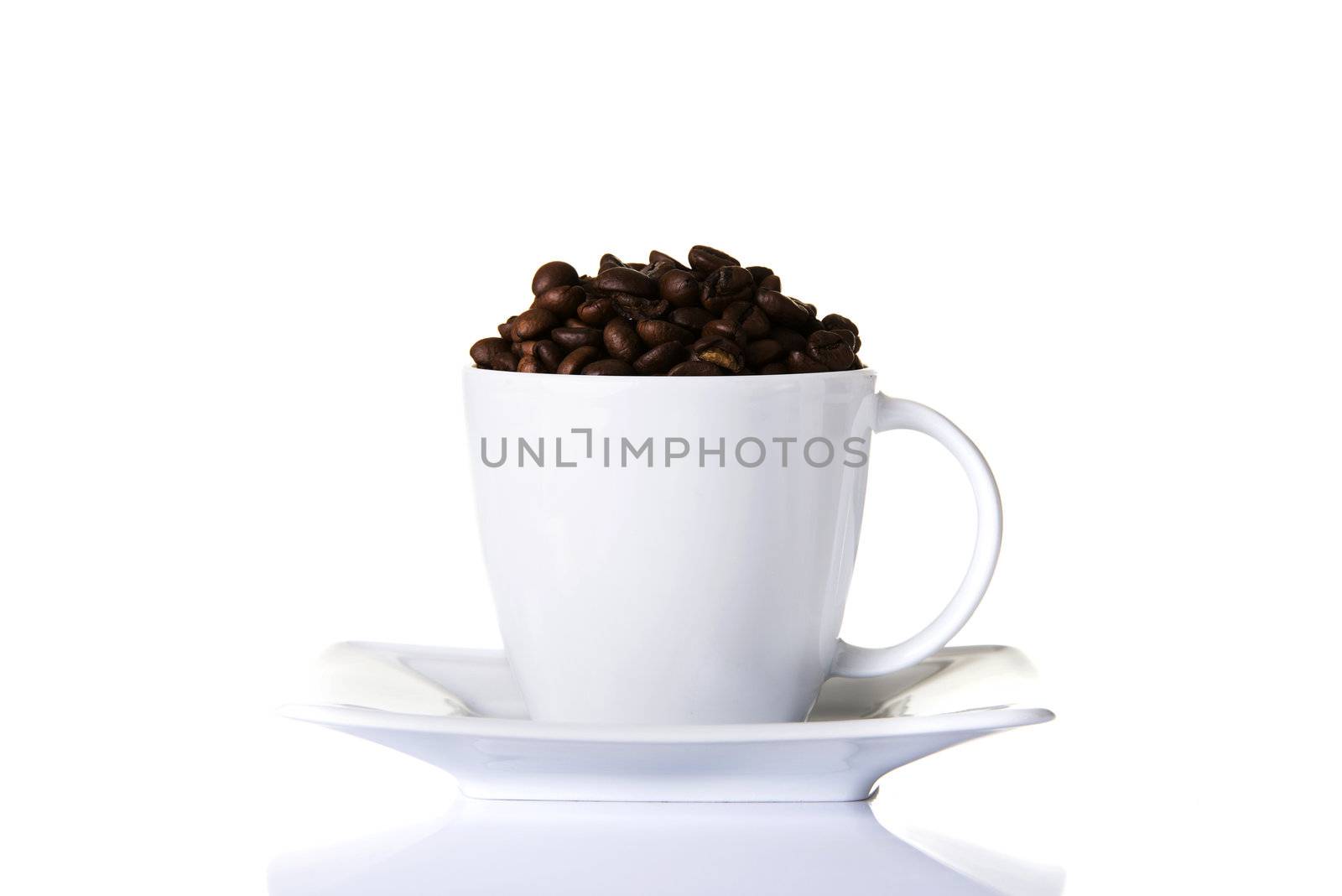 Coffee beans in a cup by BDS
