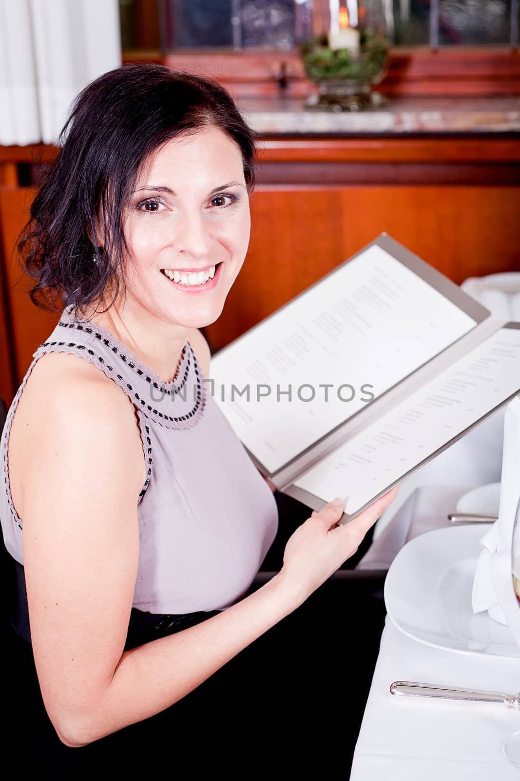 man and woman in restaurant waiter bring card and order food