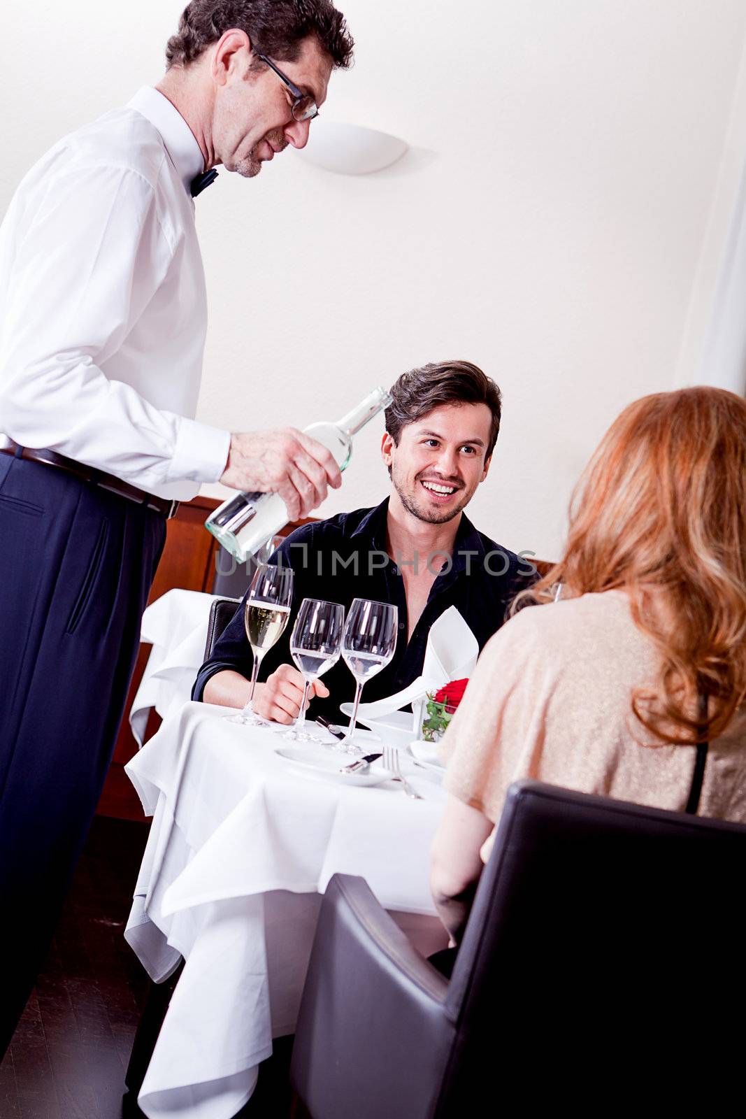 man and woman for dinner in restaurant by juniart