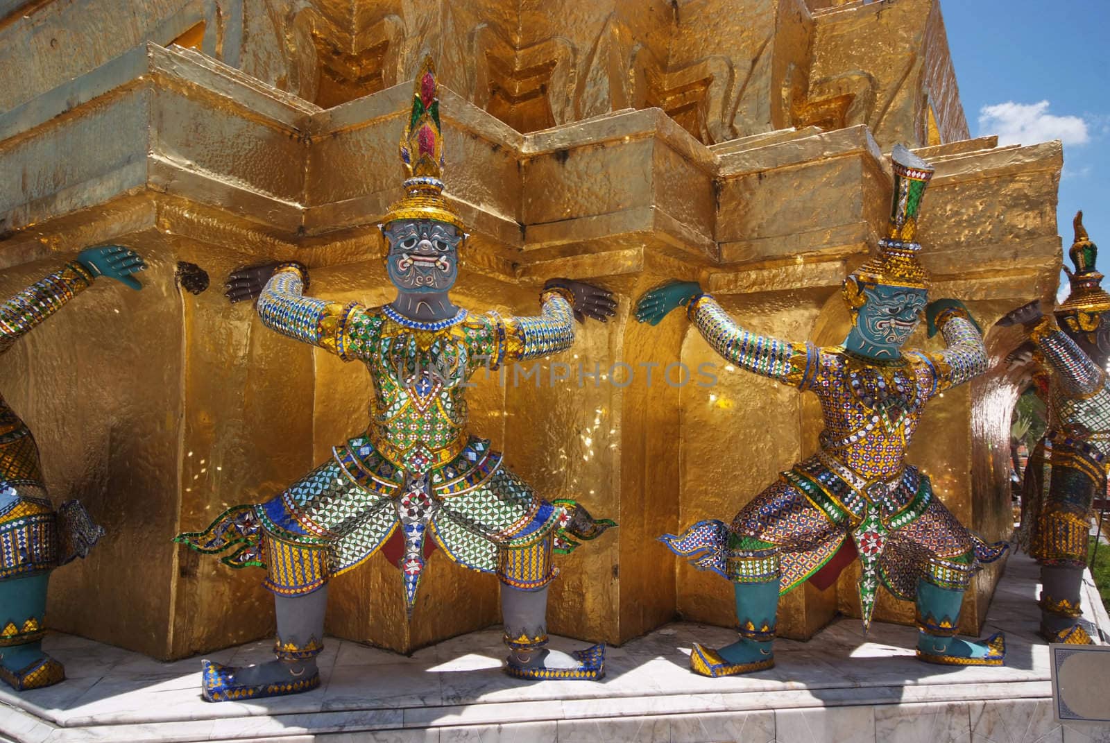 Giant statue of a beautiful Golden Pagoda in Wat Phra Kaew by opasstudio