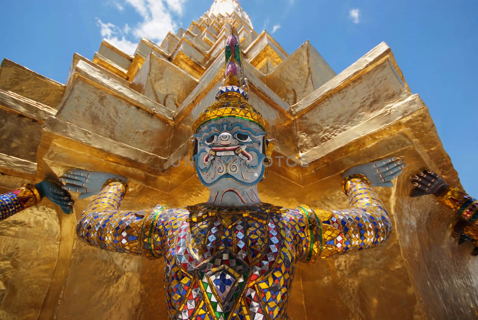 Giant statue of a beautiful Golden Pagoda in Wat Phra Kaew by opasstudio