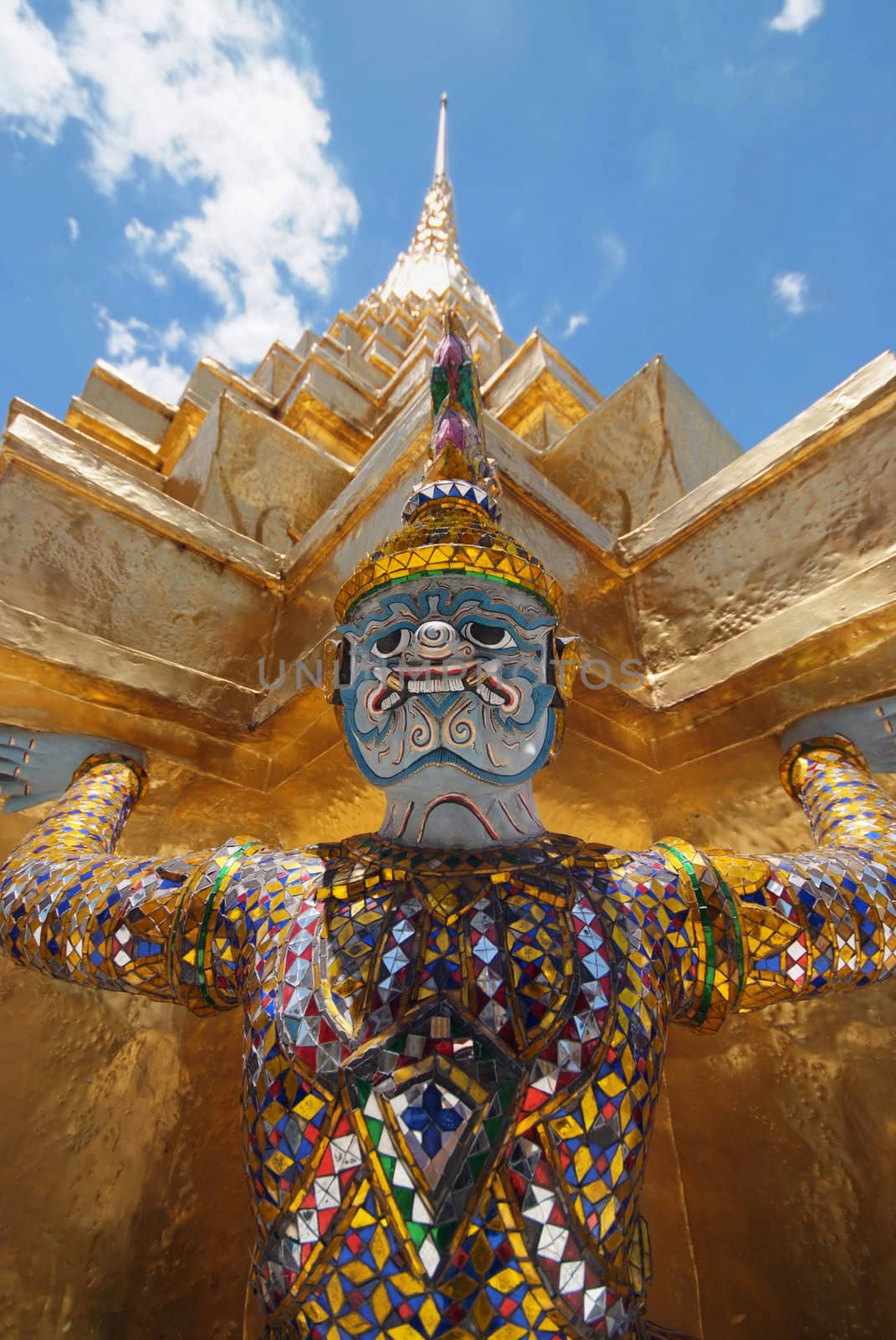 Giant statue of a beautiful Golden Pagoda in Wat Phra Kaew by opasstudio