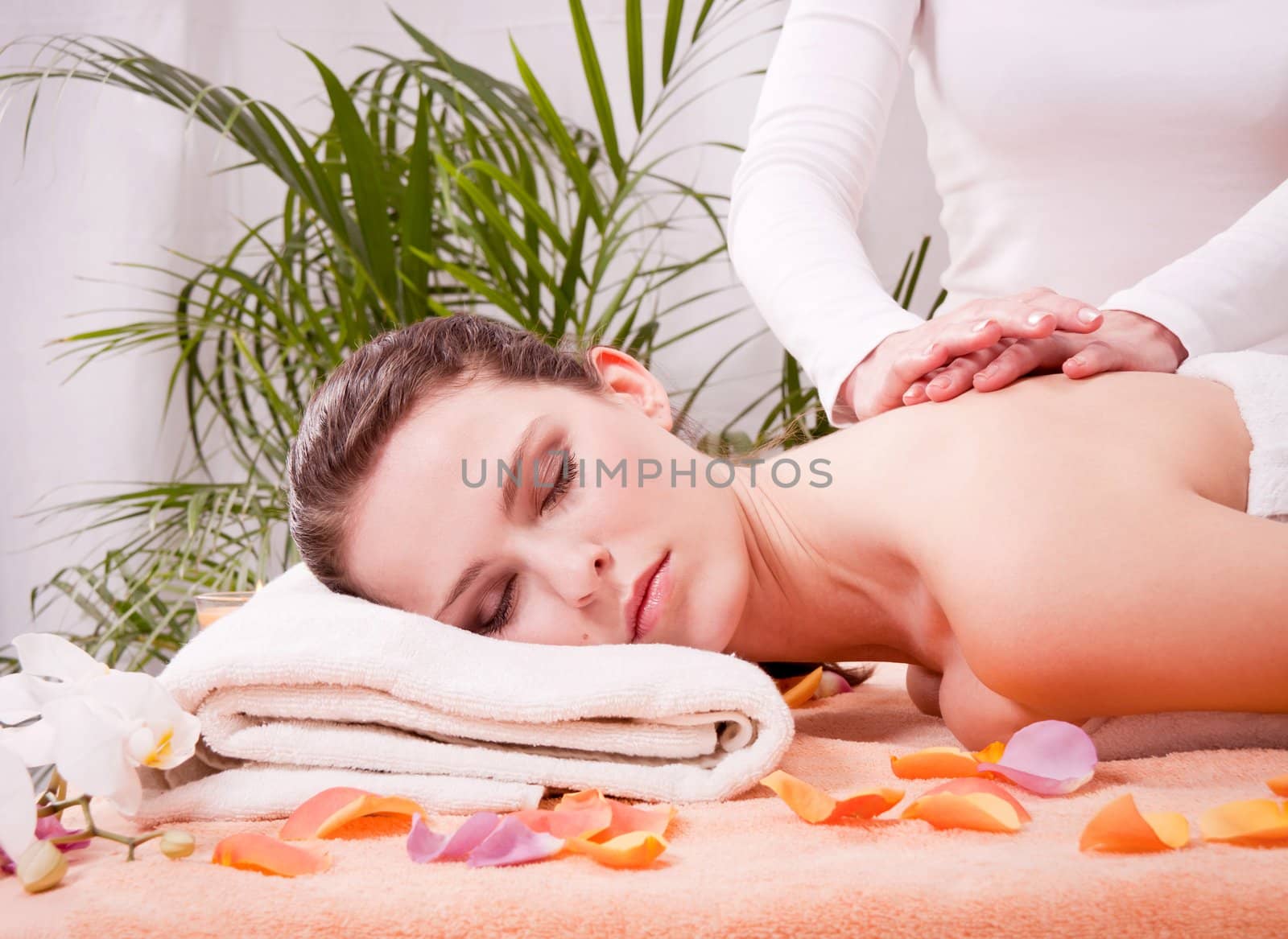 young attractive smilig woman doing wellness spa relaxing massage