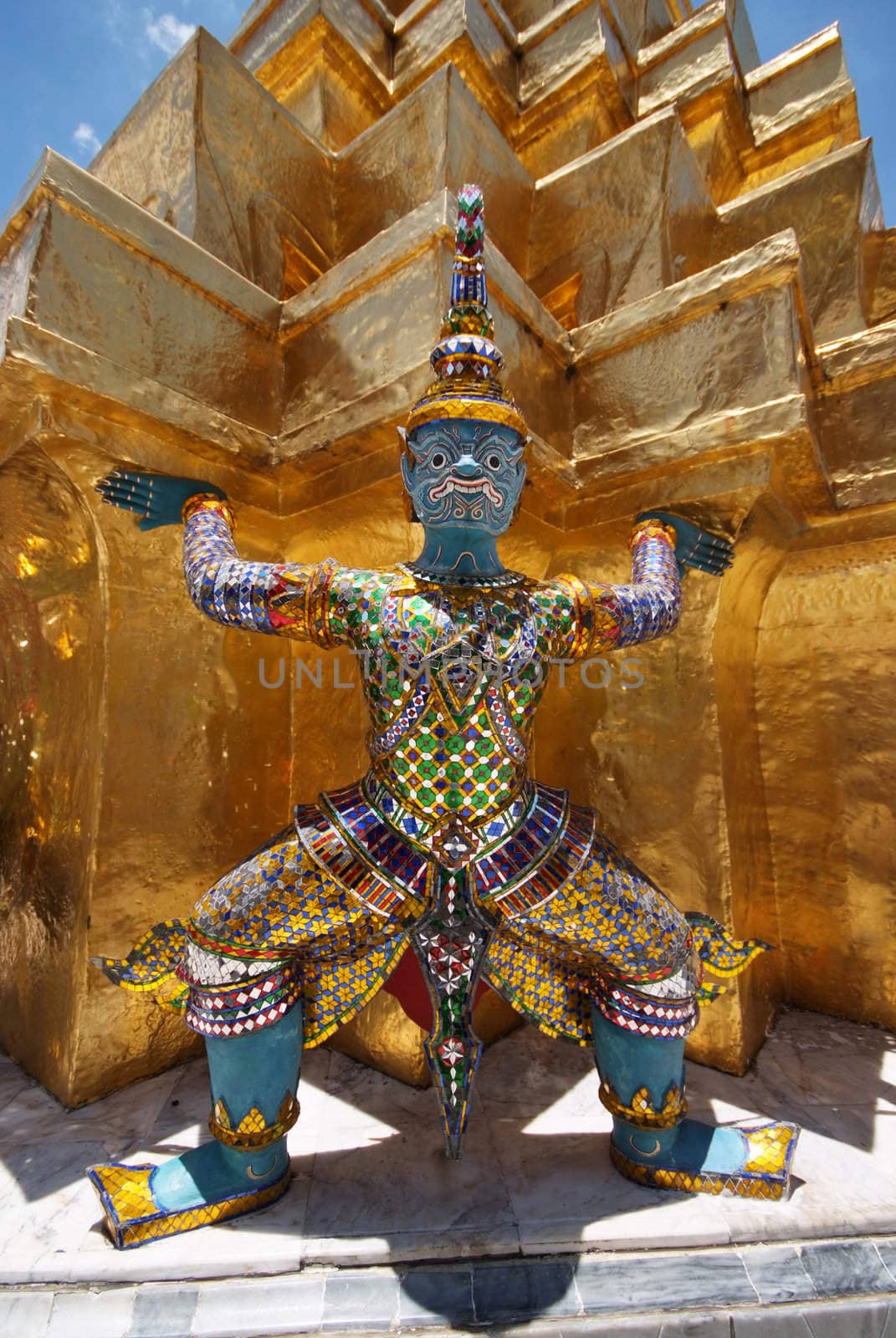 Giant statue of a beautiful Golden Pagoda in Wat Phra Kaew by opasstudio