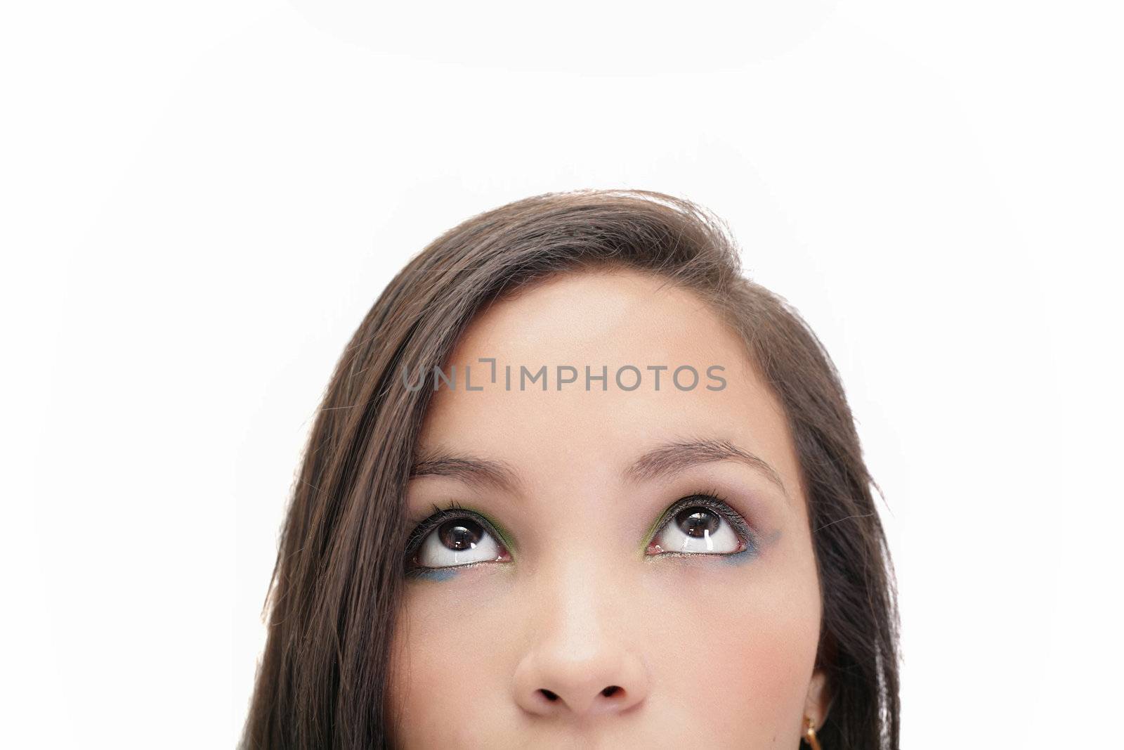 Closeup portrait of a beautiful young woman looking up, isolated by dacasdo