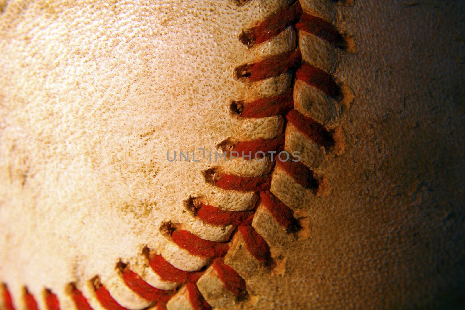 A closeup of an old weathered baseball