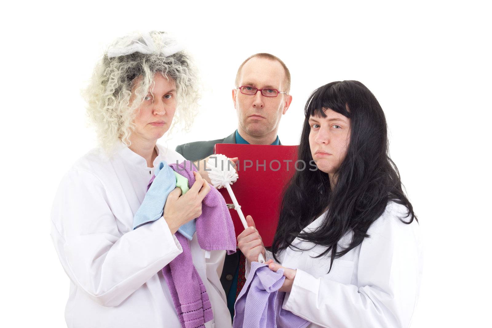 Female cleaners in white work coats with supervisor