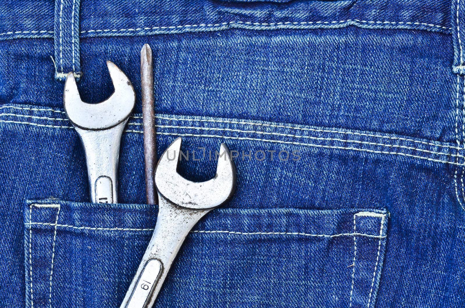 tools in new blue jeans