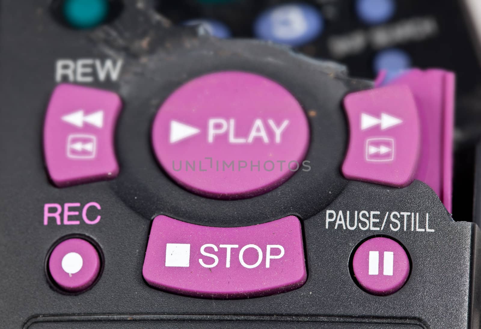 Broken remote control with focus on stop button