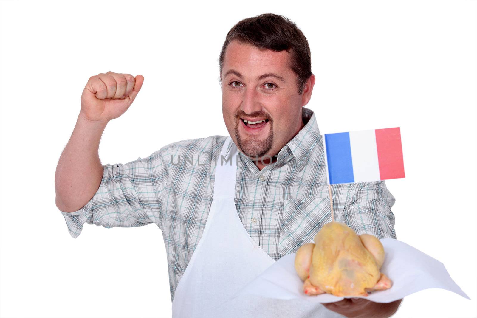 Man in a white apron celebrating French poultry by phovoir