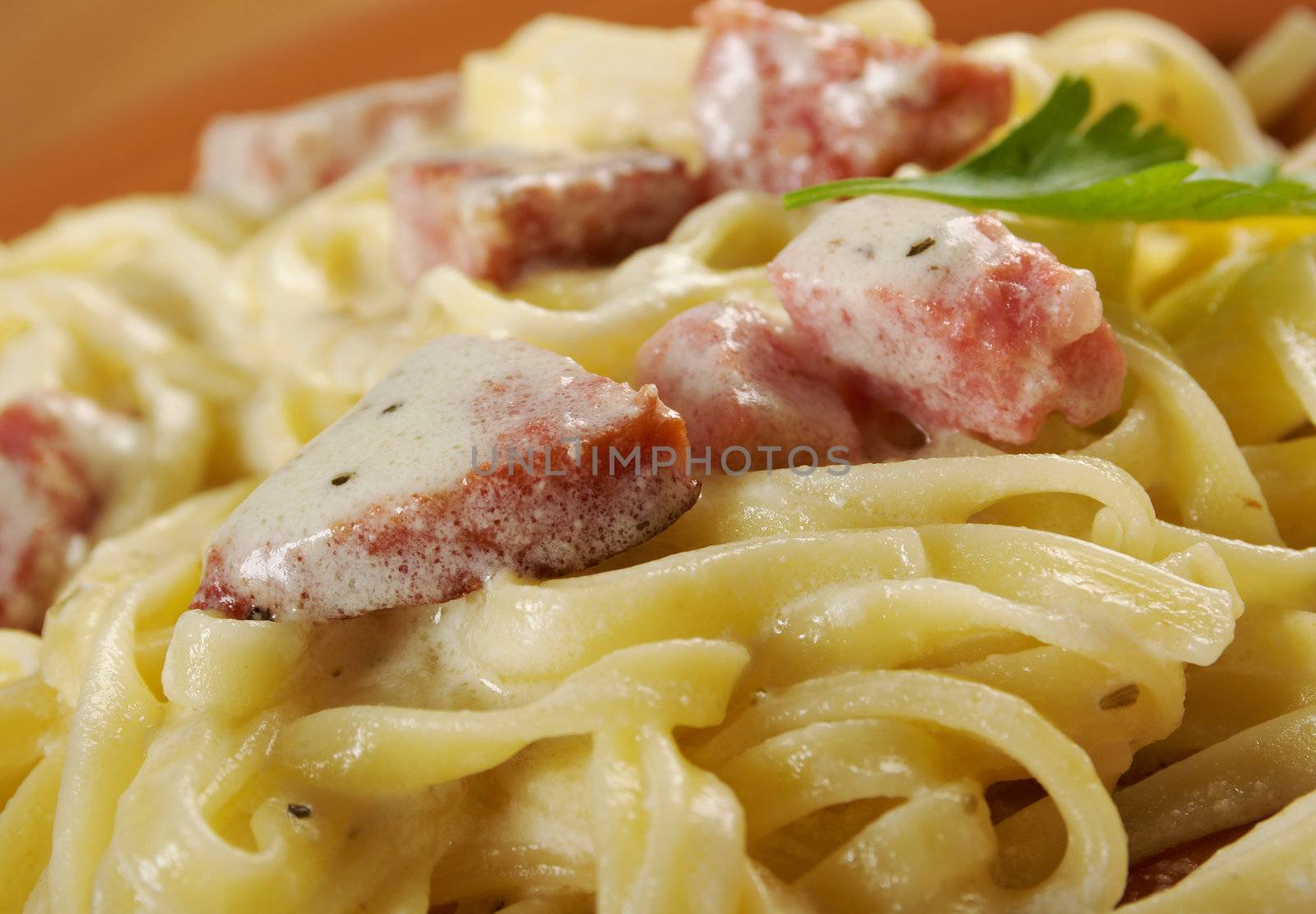 pasta Fettuccine Alfredo with sausage. close-up