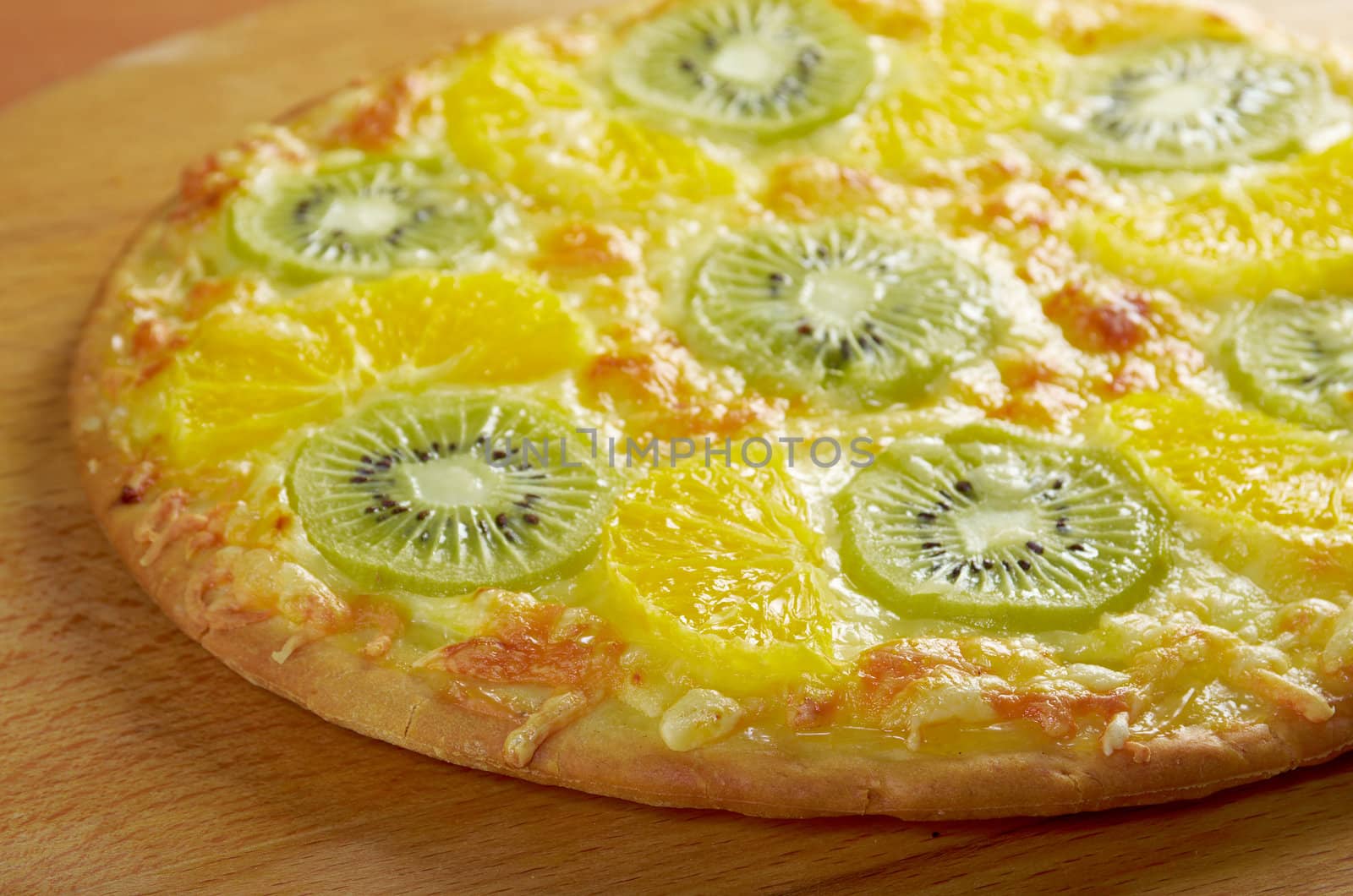 homemade sweet pizza with fruit.with orang kiwi,sauce