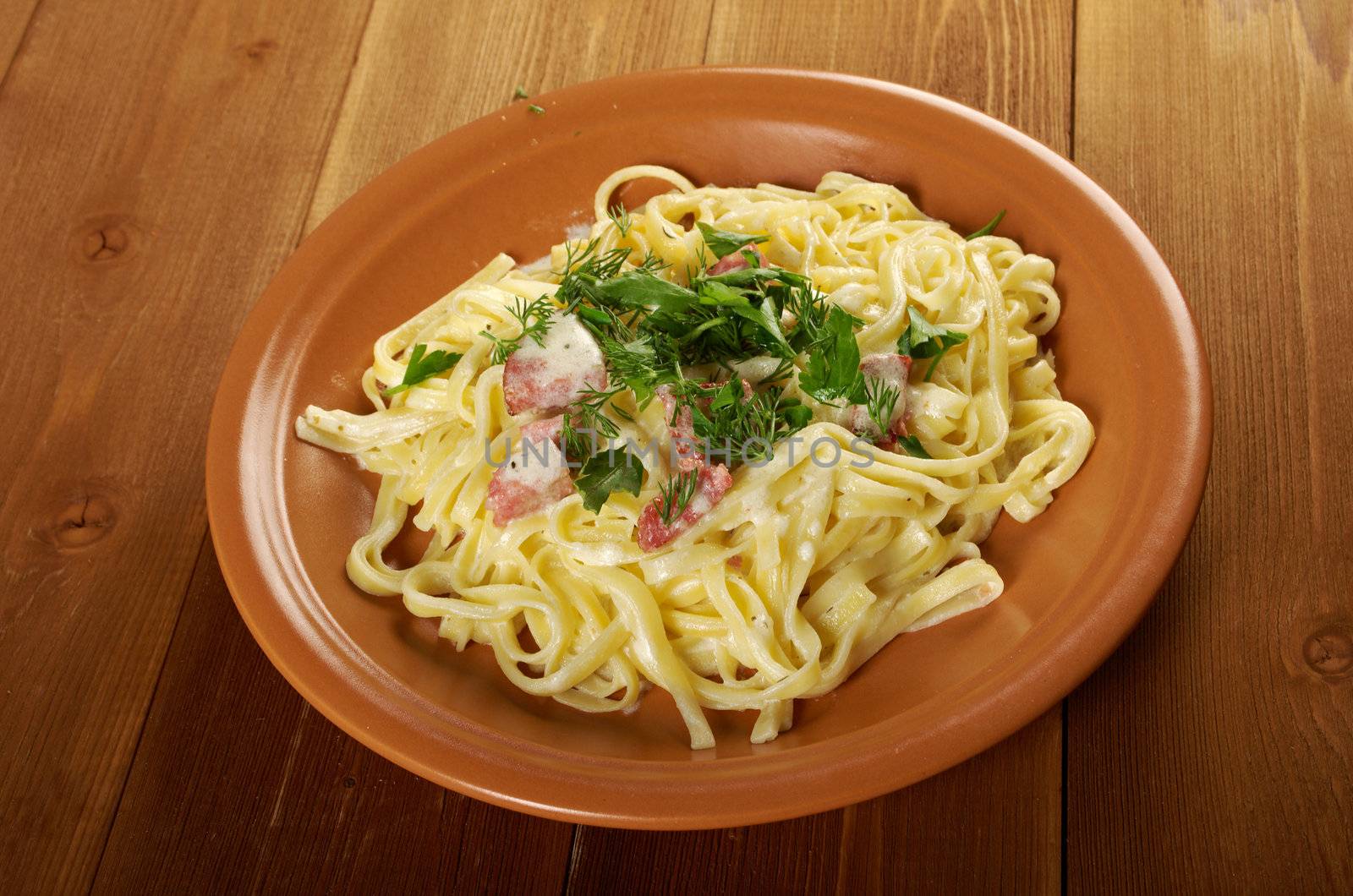 pasta Fettuccine Alfredo with sausage. close-up