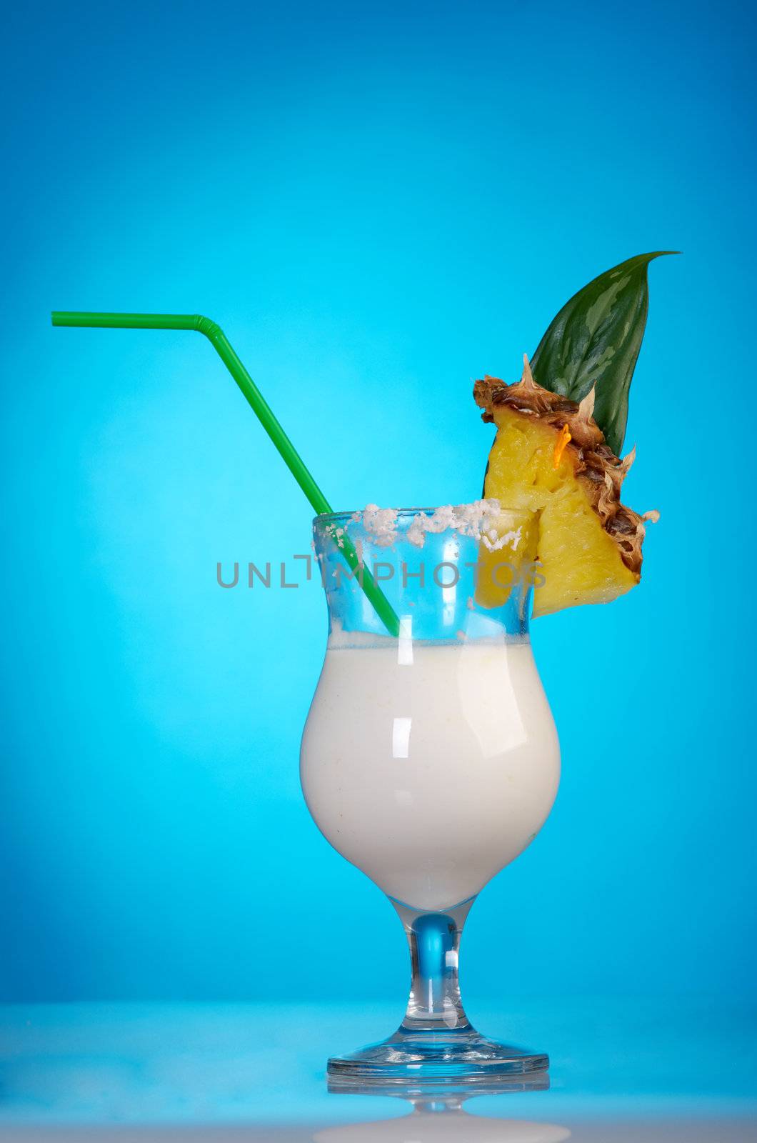 Pina Colada - Cocktail with Cream, Pineapple Juice and Rum on blue background