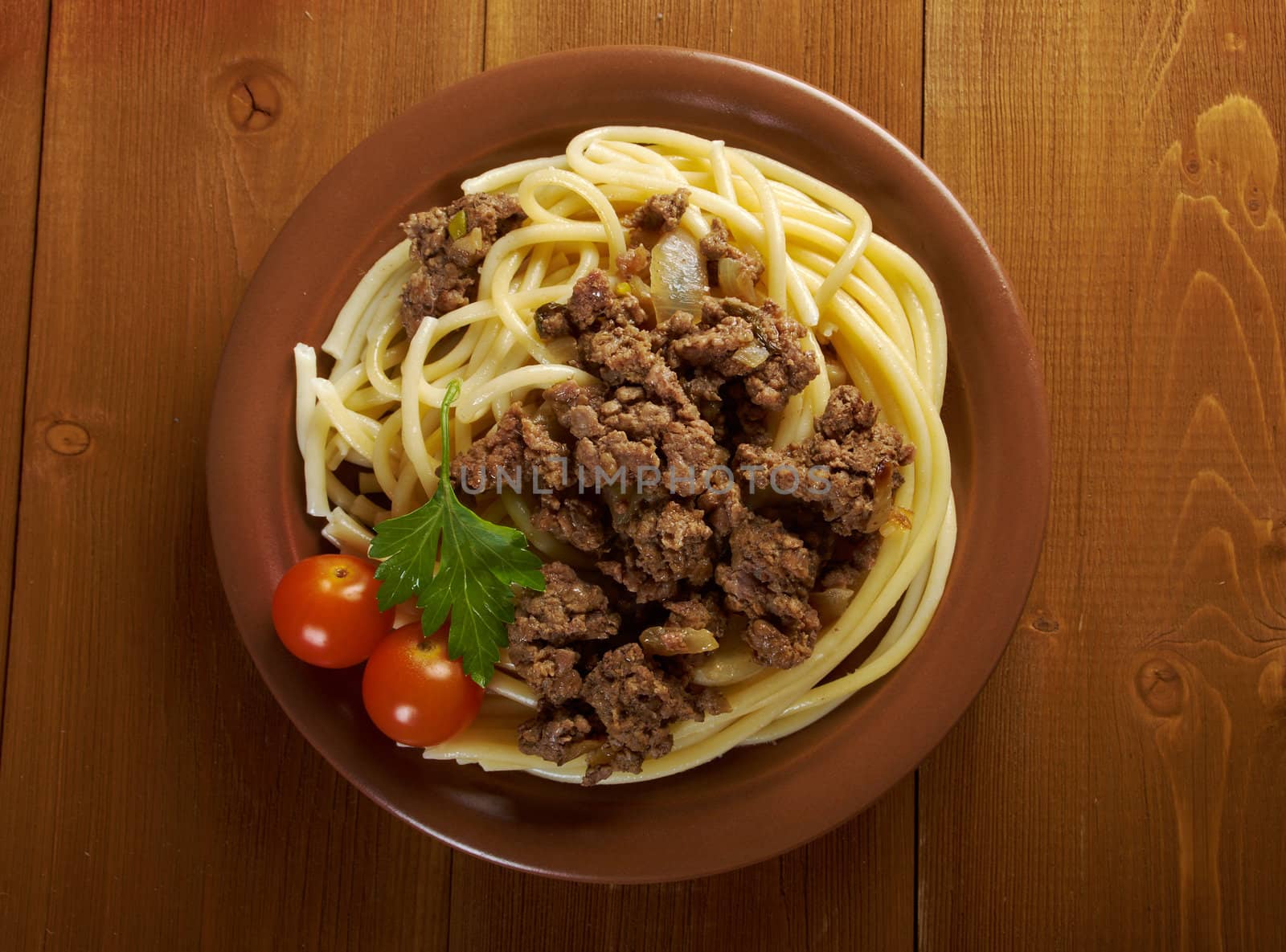  pasta with  beef on wooden table