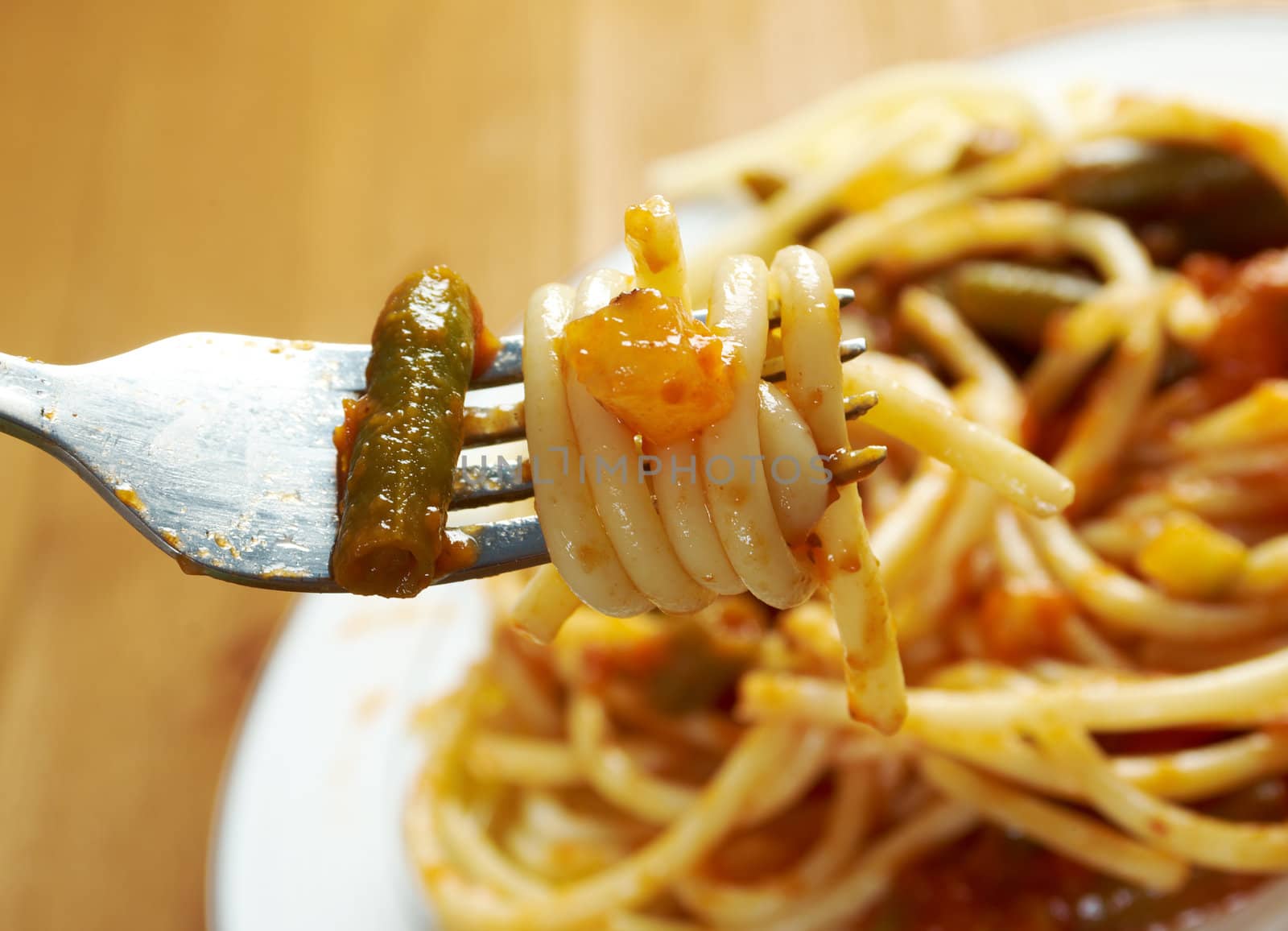  pasta with tomato  sauce  on wooden table