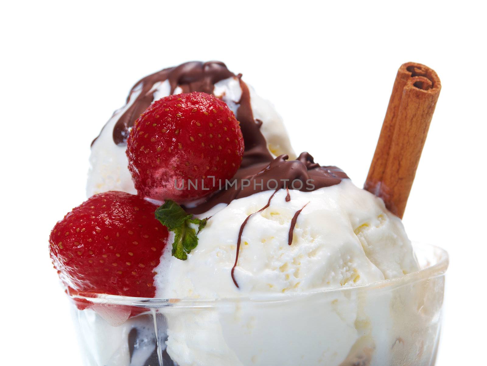 ice cream  with chocolate sauce and strawberries,cinnamon. closeup.isolated on white background.
