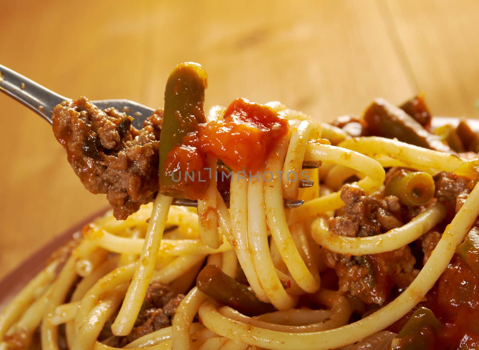  pasta with  beef ,vegetable  tomato sauce  on wooden table