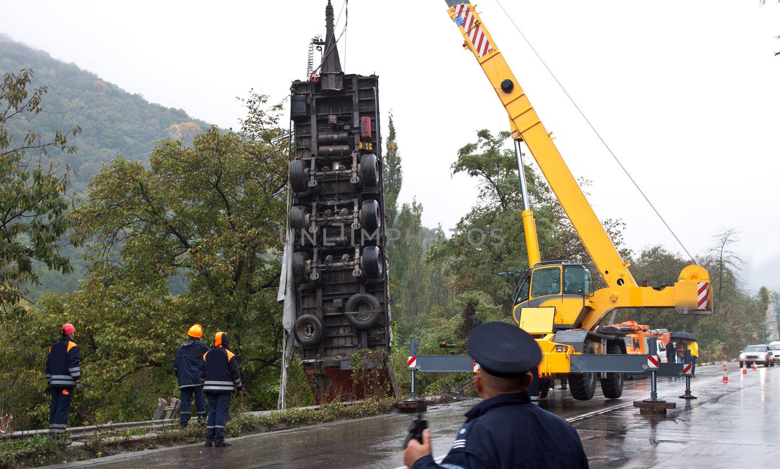 Crane lifting a truck after crash accident