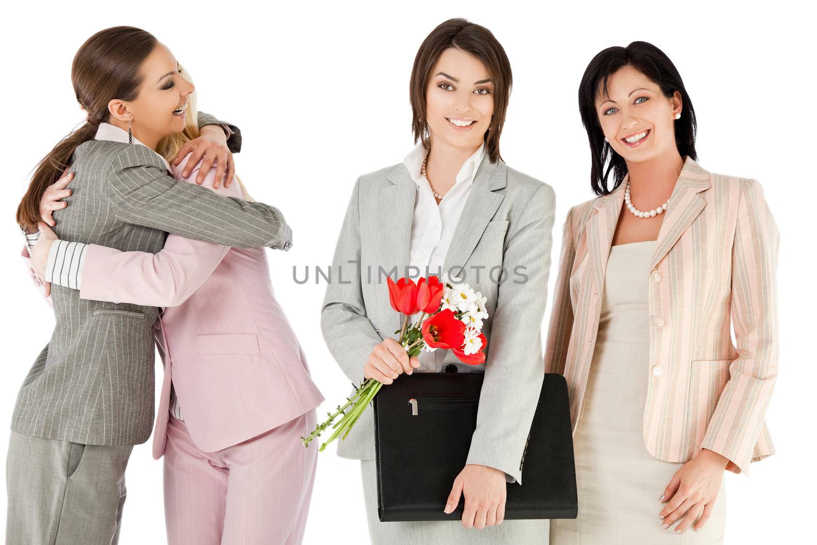 Group of four happy businesswomen standing, smiling, celebrating success