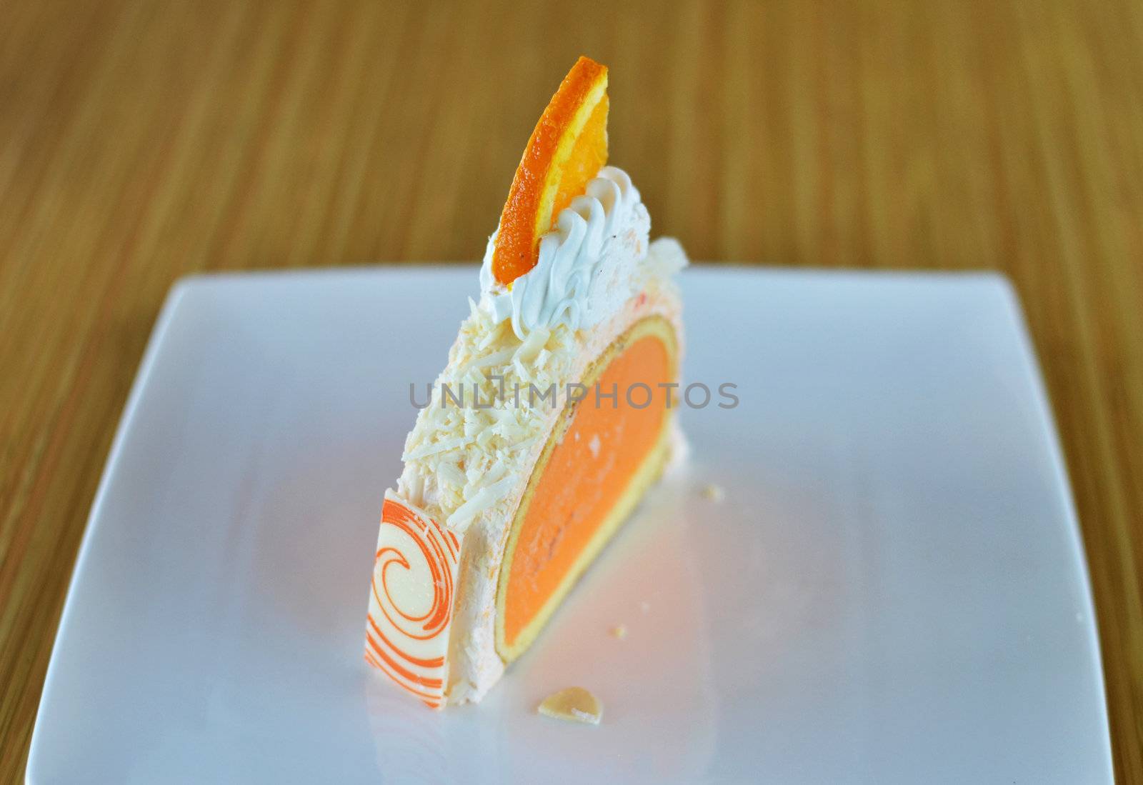 orange ice cream cake with whipped cream