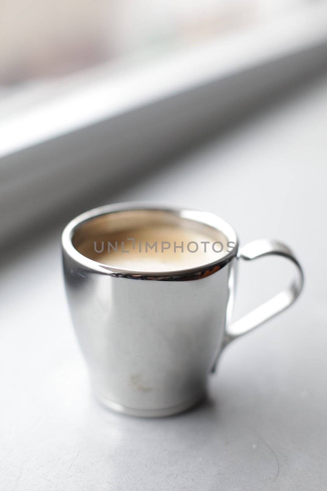 Espresso pouring into a cup by yucas