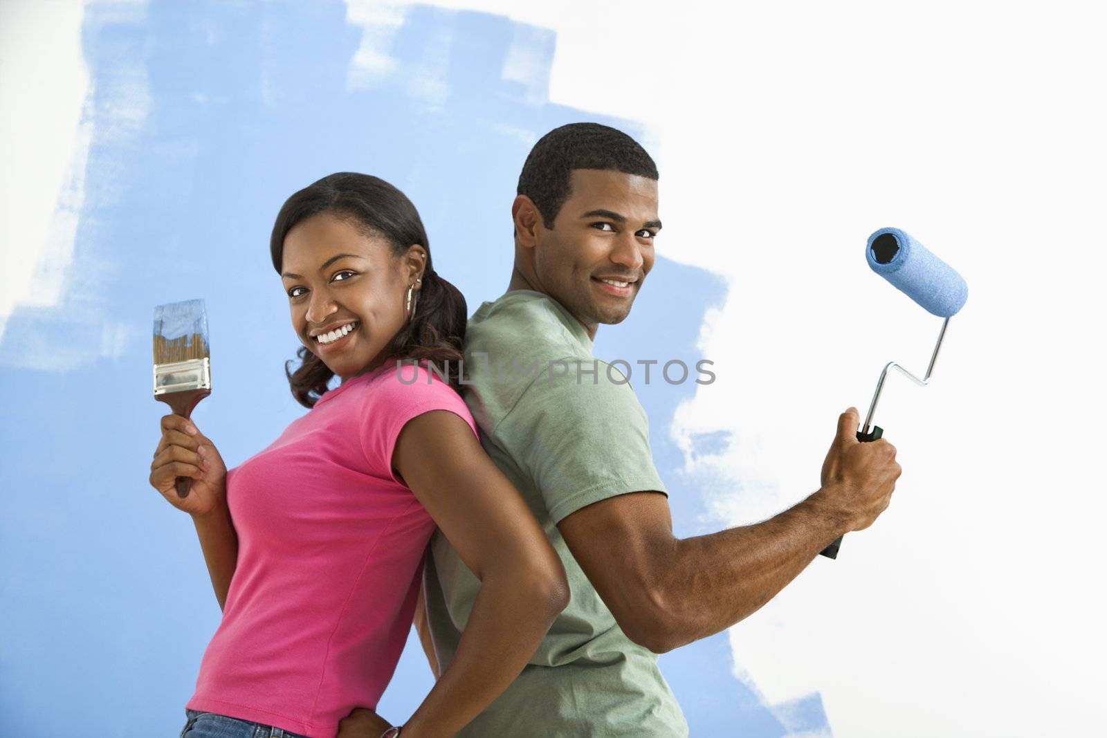 Man and woman ready to paint. by iofoto
