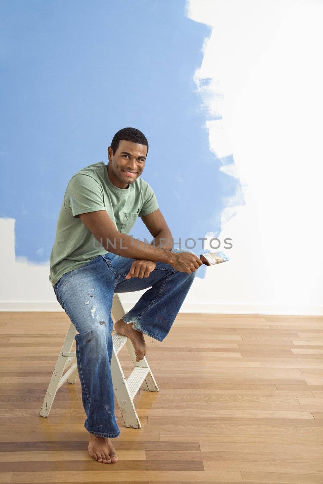 Man with paint brush. by iofoto