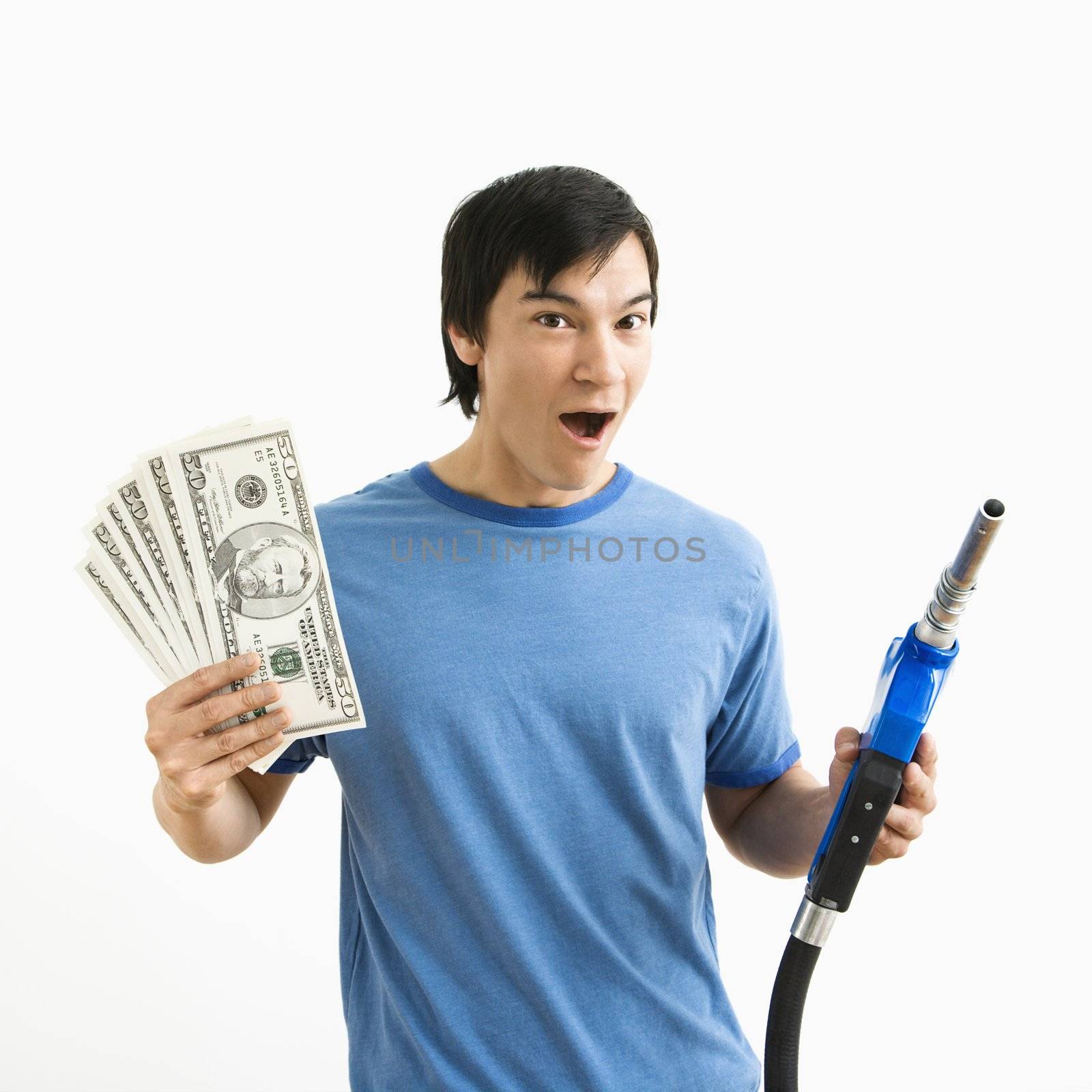 Man with money and gas nozzle. by iofoto
