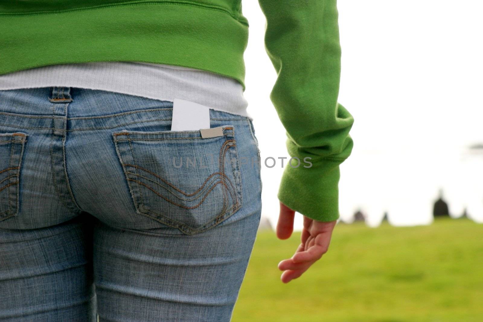 Butt of a young girl with grass in the background.