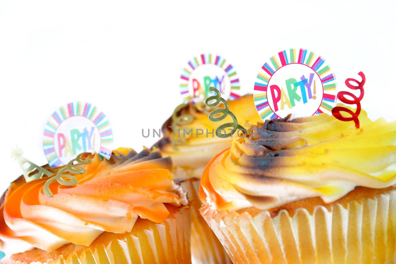 Close up of the word party on a cupcake isolated on white with copyspace.  Used a shallow depth of field and selective focus.