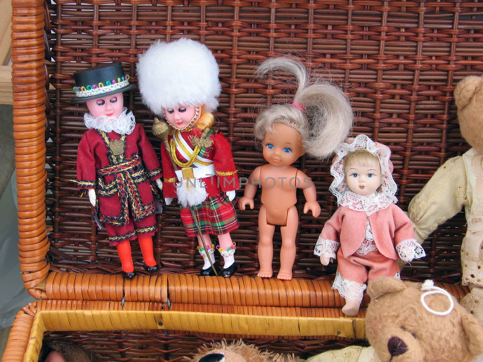 Selection of handmade dolls and figurines in a flea market