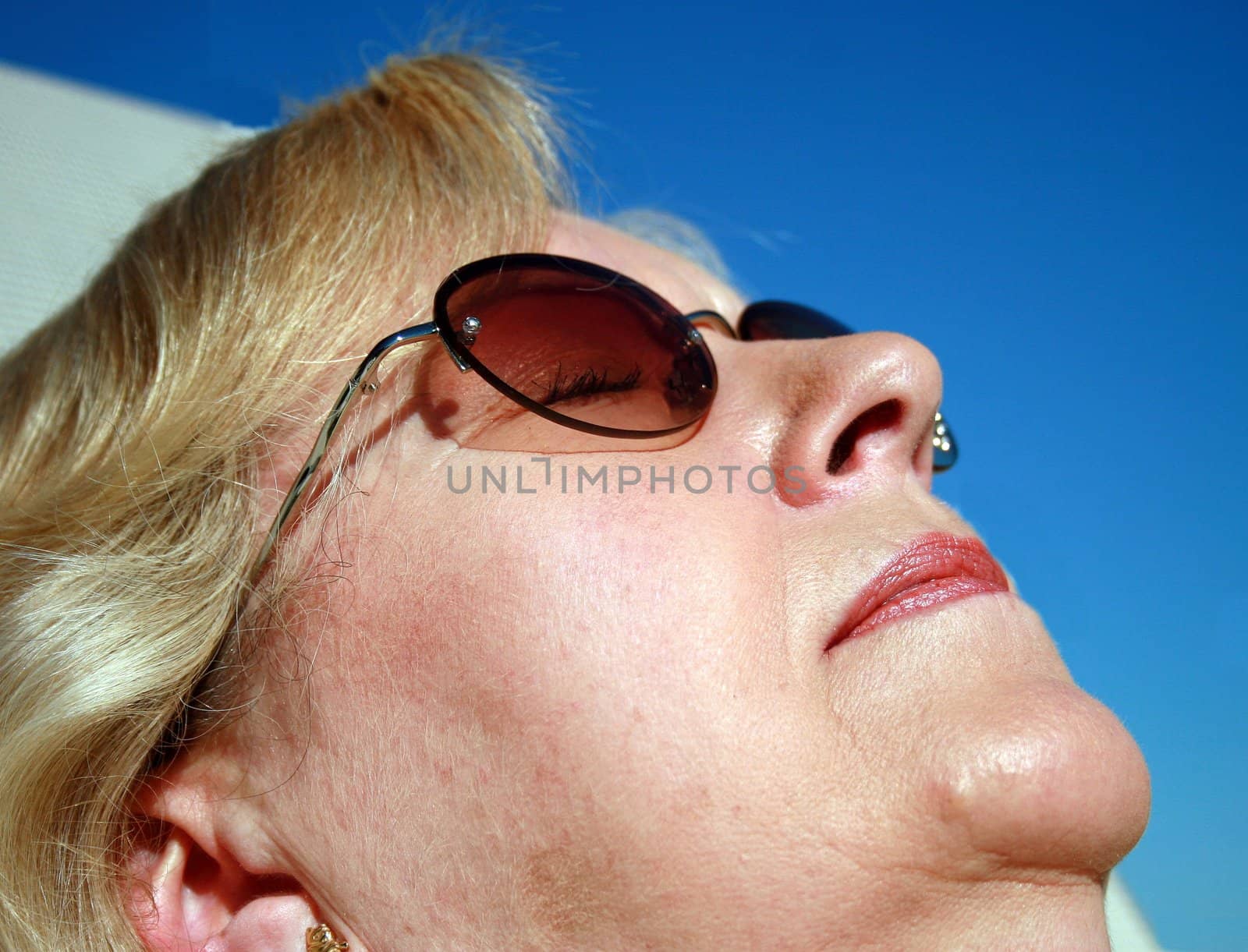 Carole sunbathing in Florida, relaxing in the sun.