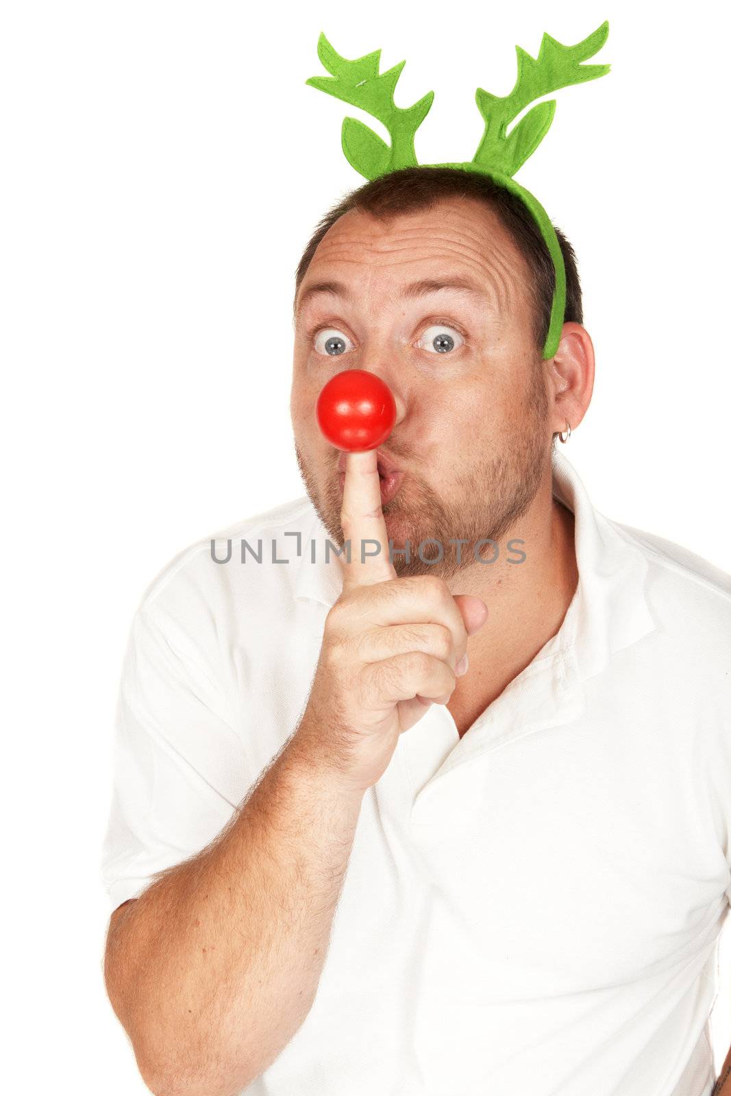 Handsome adult Caucasian man with green reindeer horns and red nose