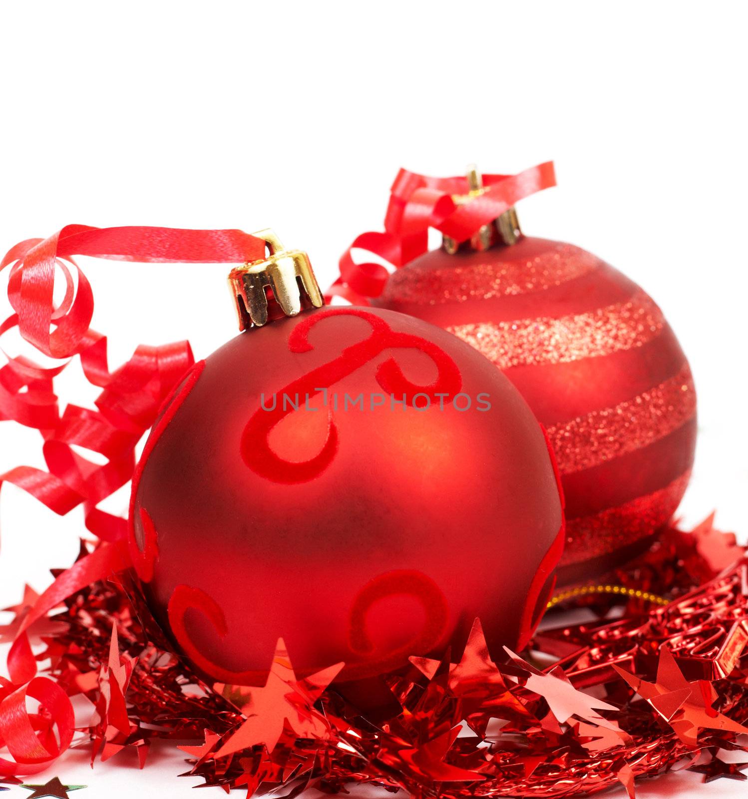Red Christmas baubles and tinsel isolated on white background with copy space. 