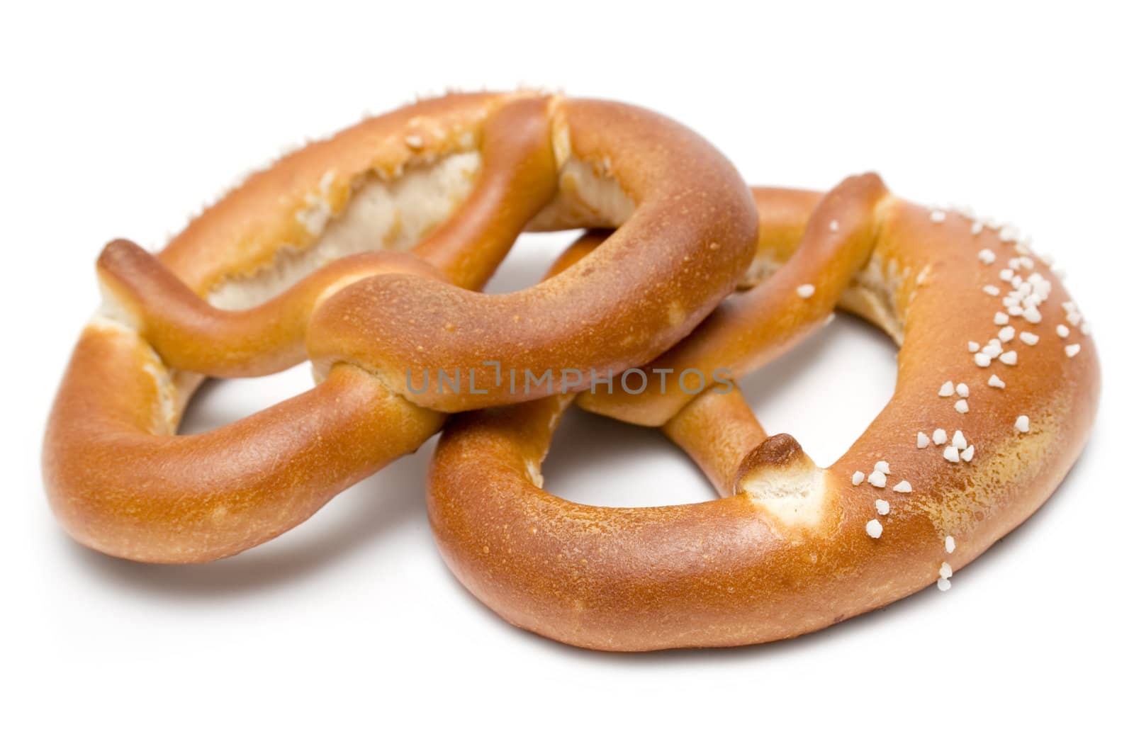 Salted pretzels isolated on a white background.