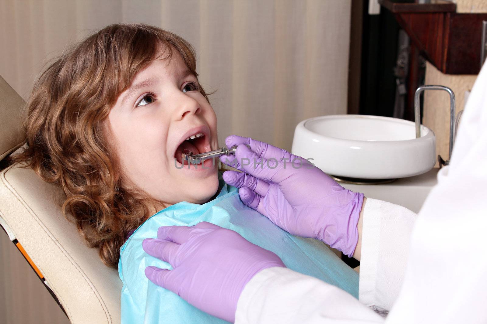 little girl patient at the dentist by goce