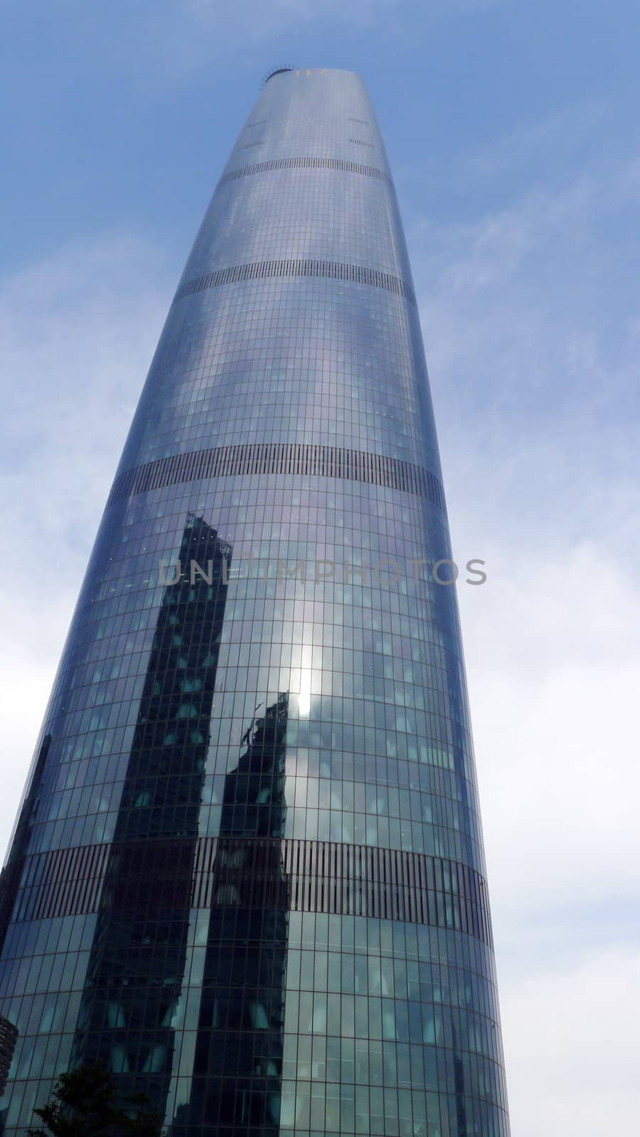 Landmark of modern skyscraper against blue sky